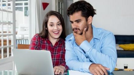 Couple looking at auto loan options